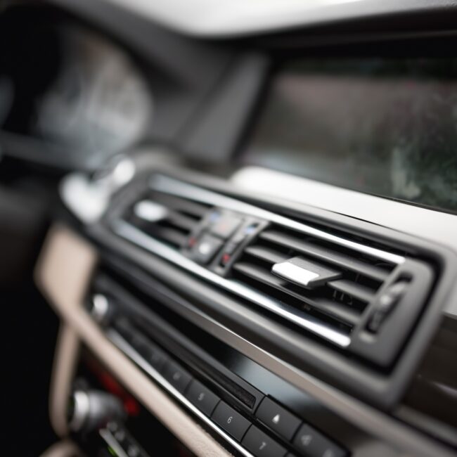 modern car interior with close-up of ventilation system holes